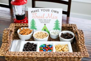 Your kiddos will love this easy DIY Trail Mix Bar. It's perfect for snacktime, a playdate, or even for a camping birthday party. Download the FREE Printable Sign to easily set up your own!