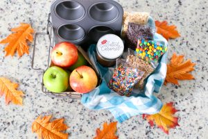 Surprise your kids this Fall with a basket full of Ingredients to make an Easy Kid-Friendly Caramel Apple Bar. Perfect for an afternoon snack or a special gift for teachers and neighbors!