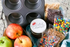 Surprise your kids this Fall with a basket full of Ingredients to make an Easy Kid-Friendly Caramel Apple Bar. Perfect for an afternoon snack or a special gift for teachers and neighbors!