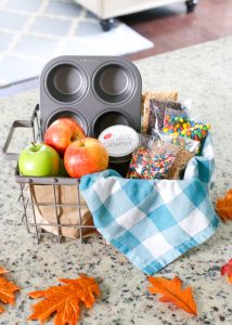Surprise your kids this Fall with a basket full of Ingredients to make an Easy Kid-Friendly Caramel Apple Bar. Perfect for an afternoon snack or a special gift for teachers and neighbors!