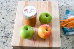 Surprise your kids this Fall with a basket full of Ingredients to make an Easy Kid-Friendly Caramel Apple Bar. Perfect for an afternoon snack or a special gift for teachers and neighbors!