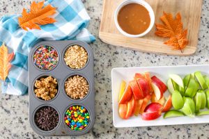 Surprise your kids this Fall with a basket full of Ingredients to make an Easy Kid-Friendly Caramel Apple Bar. Perfect for an afternoon snack or a special gift for teachers and neighbors!