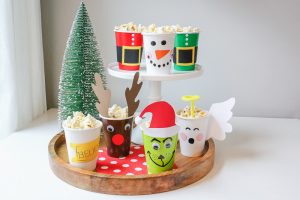 Christmas Movie Night just got more fun with these darling DIY Christmas Popcorn Treat Cups. They pair perfectly with your favorite Christmas movies!