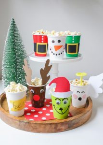 Christmas Movie Night just got more fun with these darling DIY Christmas Popcorn Treat Cups. They pair perfectly with your favorite Christmas movies!