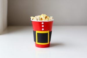 Christmas Movie Night just got more fun with these darling DIY Christmas Popcorn Treat Cups. They pair perfectly with your favorite Christmas movies!