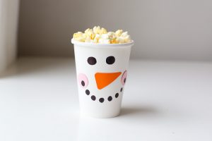 Christmas Movie Night just got more fun with these darling DIY Christmas Popcorn Treat Cups. They pair perfectly with your favorite Christmas movies!