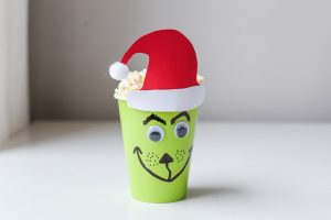 Christmas Movie Night just got more fun with these darling DIY Christmas Popcorn Treat Cups. They pair perfectly with your favorite Christmas movies!