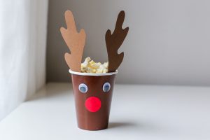 Christmas Movie Night just got more fun with these darling DIY Christmas Popcorn Treat Cups. They pair perfectly with your favorite Christmas movies!