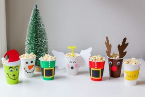 Christmas Movie Night just got more fun with these darling DIY Christmas Popcorn Treat Cups. They pair perfectly with your favorite Christmas movies!