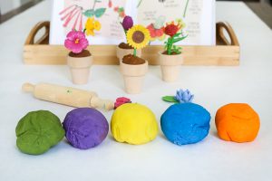 Want to add some pizzazz to your play dough creations? This easy DIY Flower Pot Play Dough Kit is perfect for kids of all ages and so easy to put together. This kit encourages open ended play and imagination as kids build and decorate with the supplies in the box. It would also make the perfect birthday gift for the budding artist in your life.