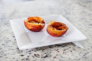 Baked Peaches are a delicious summer treat that are perfect to make with kids!
